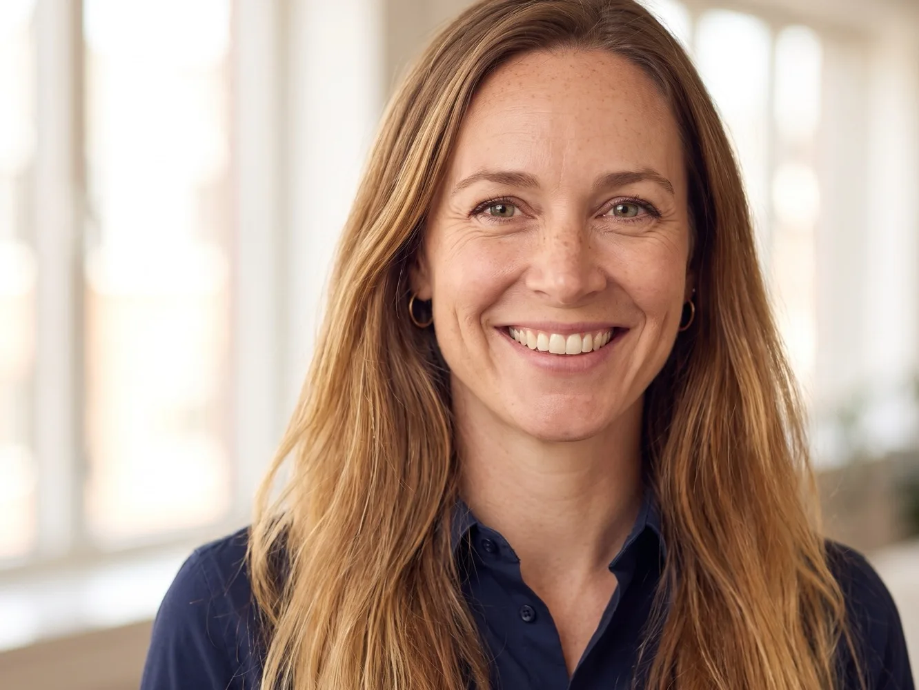 Close-up of a smiling finance controller in her office